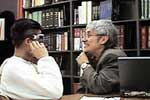 Photo: A Gemstone doctor screens a student for vision problems.